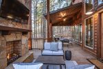 Outdoor deck with fireplace and seating
